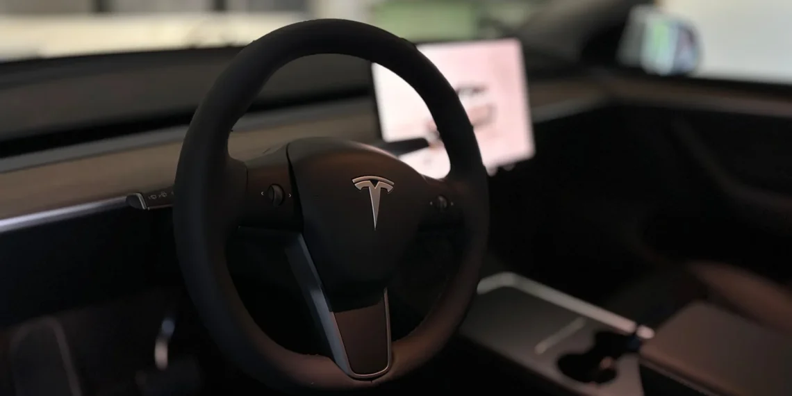 A tesla's steering wheel and interior.