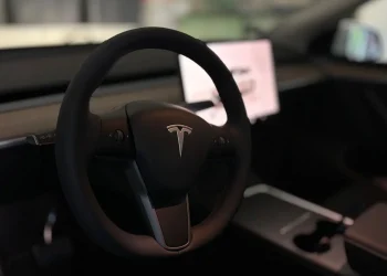 A tesla's steering wheel and interior.